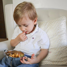 Load image into Gallery viewer, A baby boy is eating granola and apple snacks from a Kiddobloom stainless steel baby bowl