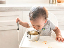 Load image into Gallery viewer, A baby boy is eating breakfast from a stainless steel bowl with handles
