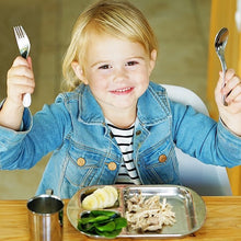 Load image into Gallery viewer, toddler girl is holding a set of princess stainless steel flatware with princess dinnerware
