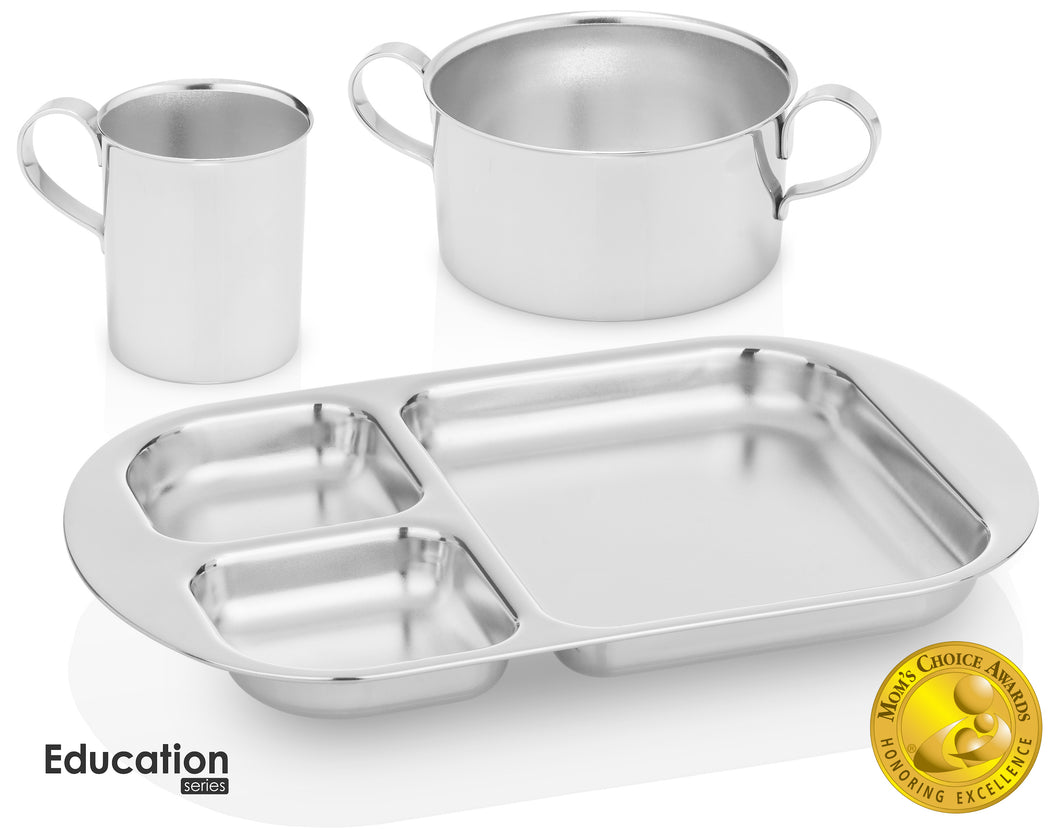 Montessori toddler stainless steel dinnerware set consists of a stainless steel cup with handle, a stainless steel bowl with handles, and a divided plate. 